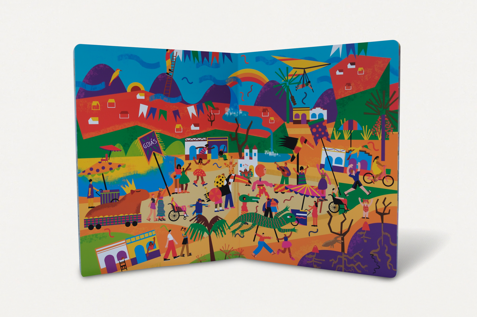 Página dupla ilustrada do Carnaval de Goiás em Cadê o Levi? No Carnaval! por Arielle Martins